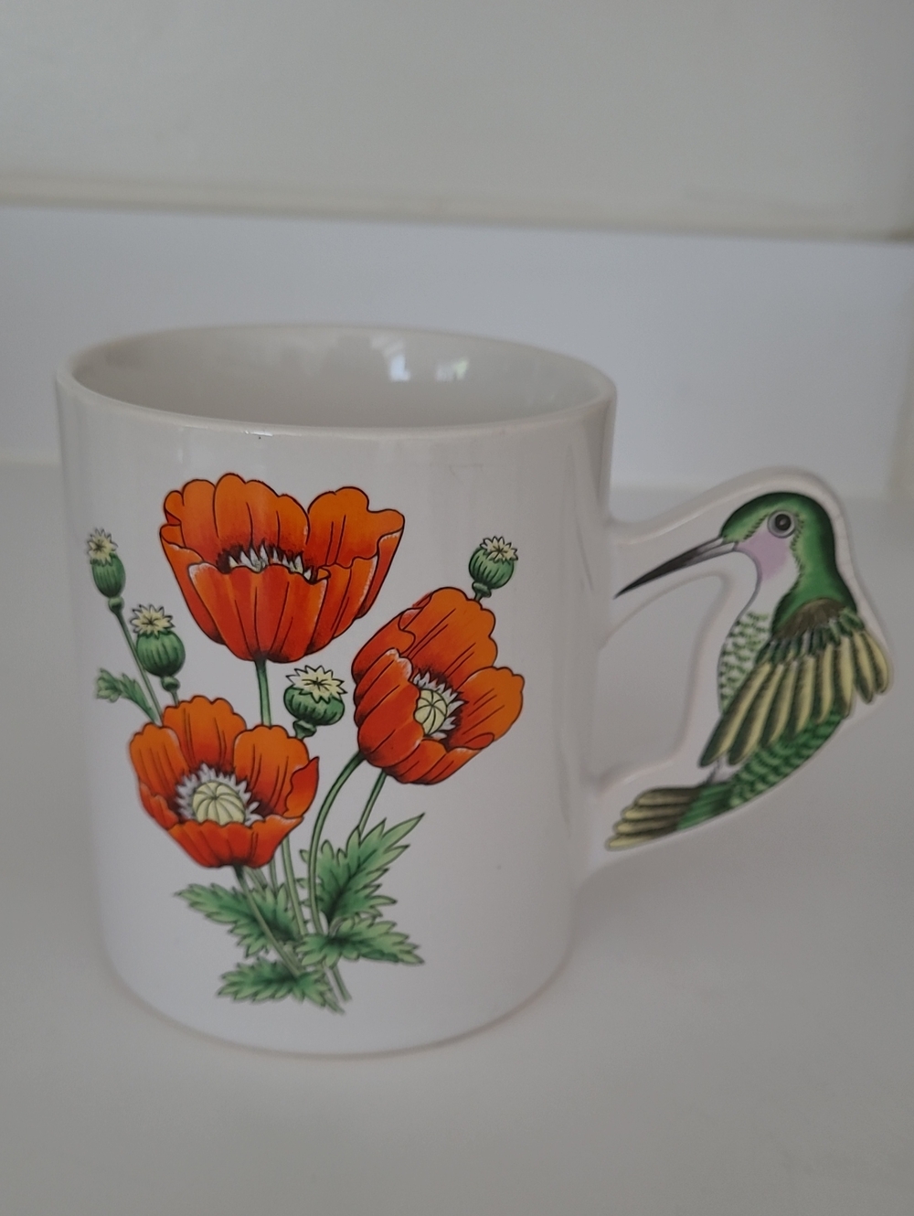 White Ceramic Mug with Orange Poppy Flowers and Hummingbird Handle
